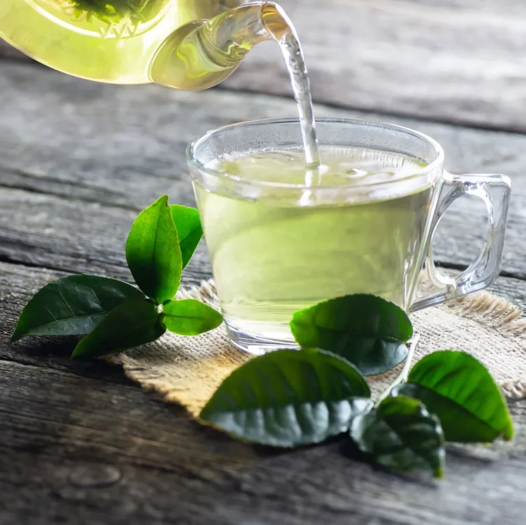 Green tea being poured into a cup for natural treatments of hair loss at hairloss-recovery