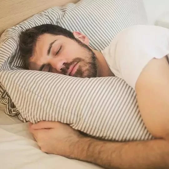 man sleeping to not deal with chronic sleep deprivation