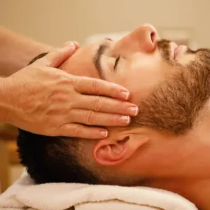 man gets scalp massage for hair loss