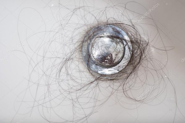 hair shedding built up in sink from telogen effluvium